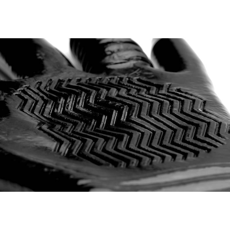Close-up of the glossy black glove palm with a raised chevron texture pattern and the base of the fingers