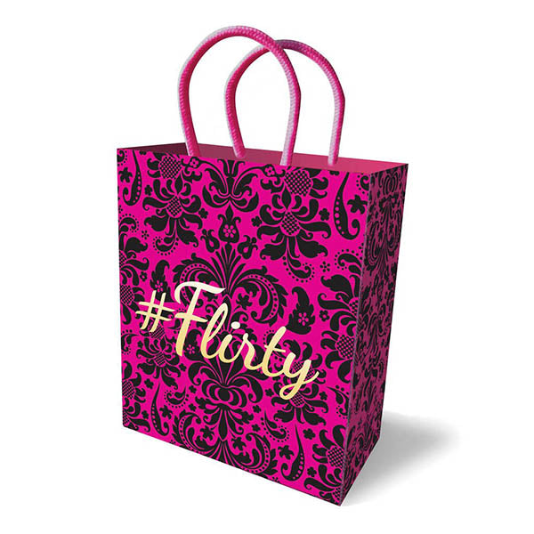 Flirty gift bag in hot pink with black damask pattern and gold lettering, featuring woven handles and elegant design